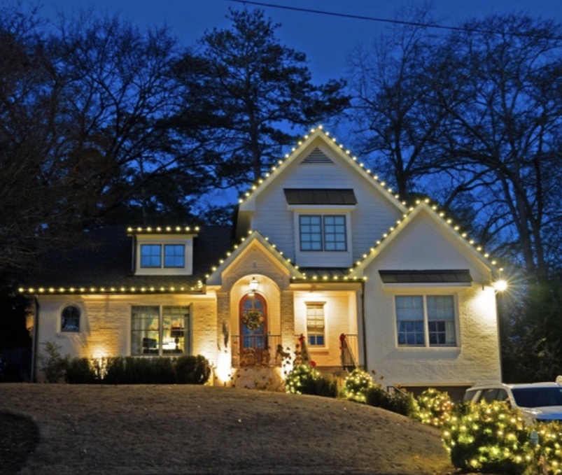Home professionally decorated with warm white Christmas lights